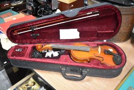 A Junior violin, with case and bow.