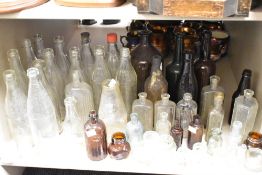 A large collection of vintage bottles, including advertising bottles of interest to Carlisle and