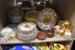 A quantity of Spode Red Grouse patterned tableware, a 19th Century Staffordshire cow ornament, an