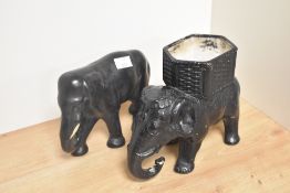 Two early 20th Century chalkware elephant ornaments, the largest measuring 18cm tall