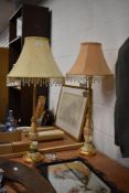 A pair of Continental style gilt table lamps with embroidered embellishments and tasselled shades,