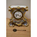 An early Victorian ceramic clock, having extensive gilt detailing with hand painted florals and