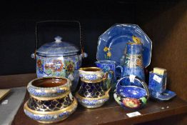 An assorted collection of Grimwades Byzanta lustre ware, a Maling style flower basket on blue