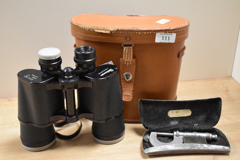 A cased pair of Pathescope 10x50 magnification field binoculars with tan leather case, and a