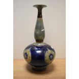 A Royal Doulton Art Nouveau stoneware vase, of baluster form with elongated neck, having grey and