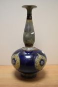 A Royal Doulton Art Nouveau stoneware vase, of baluster form with elongated neck, having grey and