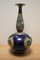 A Royal Doulton Art Nouveau stoneware vase, of baluster form with elongated neck, having grey and