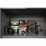 A mid-20th Century Ilford Sportsman 35mm camera, two vintage Kodak Brownie box cameras, No.2 & Six-