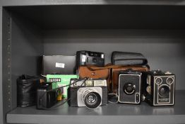 A mid-20th Century Ilford Sportsman 35mm camera, two vintage Kodak Brownie box cameras, No.2 & Six-