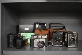 A mid-20th Century Ilford Sportsman 35mm camera, two vintage Kodak Brownie box cameras, No.2 & Six-