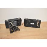 Two early 20th Century folding cameras, comprising a Kodak Autographic Brownie No.2 camera & an