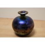 A Mdina spherical iridescent vase having petrol toned mottled decoration, with short neck and