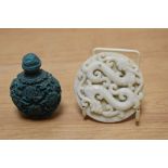 A Chinese carved white jade plaque, depicting two intertwined dragons and a carved Chinese turquoise