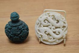 A Chinese carved white jade plaque, depicting two intertwined dragons and a carved Chinese turquoise