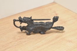 A Chinese metal Hasp or buckle, depicting dragon.