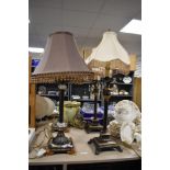 Two pairs of reproduction Neoclassical style metal table lamps with tasselled shades, the largest