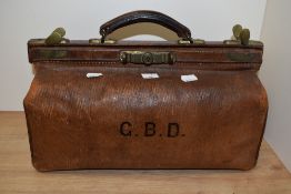 A vintage gladstone/ doctors leather bag, having initials G.B.D to front