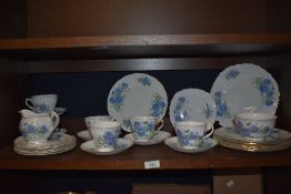 A Royal Vale Blue Cornflower design tea set, comprising teacups, milk jug, saucers, and sandwich