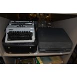 A vintage Erika typewriter, and another by Olympia, both cased