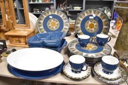 A collection of Denby table ware, including serving dishes, platters and cups and saucers.