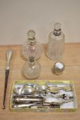 A mixed lot of hallmarked silver handled knives and a button hook, perfume bottle lid and three