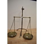 A set of 1920s brass balance scales, impressed mark for Doyle and Son, London.