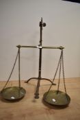 A set of 1920s brass balance scales, impressed mark for Doyle and Son, London.