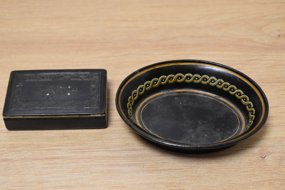 A Victorian papier mache snuff box with carved decoration to lid, inlaid with Mother Of Pearl,sold