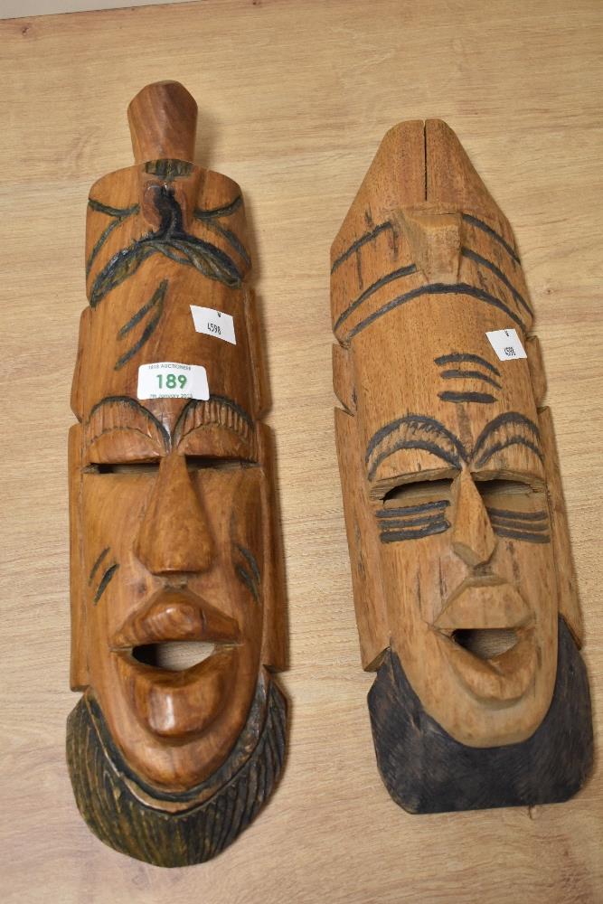 Two carved treen tribal masks and two finely carved figurines. - Image 3 of 3