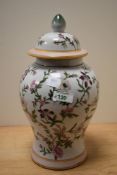 A 19th/20th Century Chinese polychrome lidded baluster vase, measuring 32cm tall