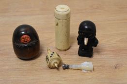 A vintage Japanese meiji Kobe/Kobi carved wood toy with pop out eyes and screw fastening, a