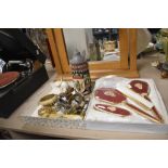 An Art Deco style four piece dressing table set with red embroidered design, and a box of costume