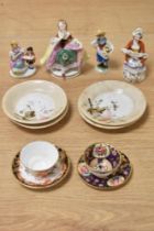 A miniature Royal Crown Derby cup and saucer and similar example, four whimsical figurines and