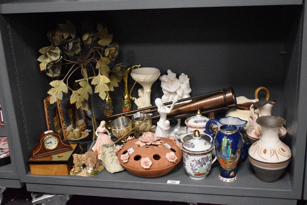 An assorted collection of decorative ceramics, including a terracotta coloured rose bowl, lustre