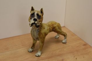 A contemporary studio pottery boxer dog study with mottled earthy toned glaze replicating brindle