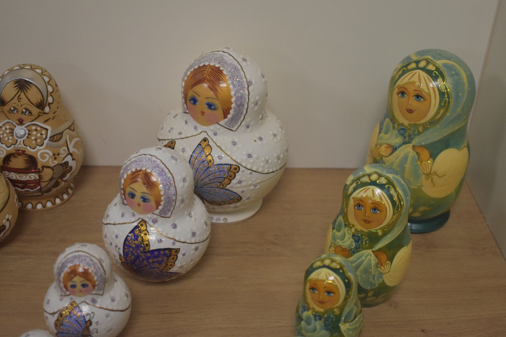 A group of six Russian hand-decorated Matryoshka dolls, of traditional form, one with white jewelled - Image 2 of 3