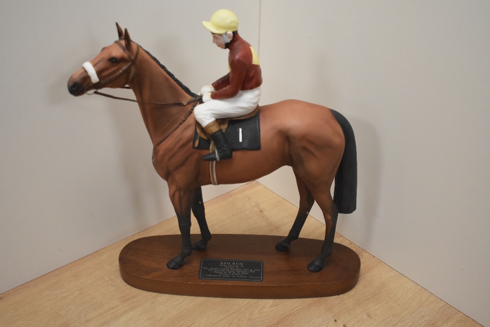 A Beswick Pottery horse racing group 'Red Rum' with jockey Brian Fletcher up, winner of The