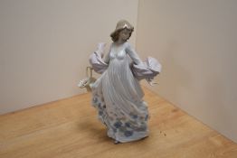 A Lladro porcelain 'Spring Splendor' figurine, number 5898, modelled as a young woman in flowing