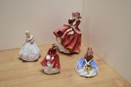 A group of two Royal Doulton bone china figurines, comprising 'Top O' The Hill' HN1834, and 'Emma'