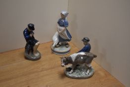 A group of three Royal Copenhagen (Denmark) porcelain figures, comprising boy with calf, number
