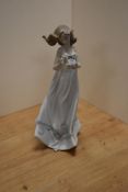 A Lladro porcelain 'Butterfly Treasures' figurine, number 6777, modelled as a young girl in