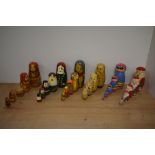 A group of six Russian hand-decorated Matryoshka dolls, of traditional form depicting Santa Claus,