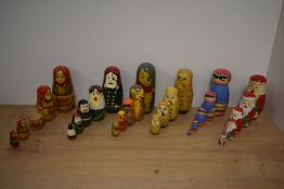 A group of six Russian hand-decorated Matryoshka dolls, of traditional form depicting Santa Claus,