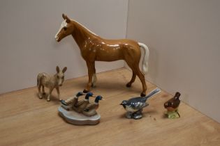 An unusual Goebel porcelain Palomino Horse study 2357, Two Beswick Pottery birds Grey Wag Tail 1041,