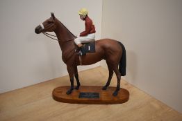 A Beswick Pottery horse racing group 'Red Rum' with jockey Brian Fletcher up, winner of The