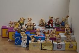 A Collection of eighteen 'Piggin' Collectible World Studios comical anthropomorphic pig figures,