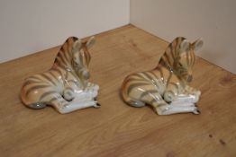 A pair of USSR Russian Lomonosov porcelain animal figures, formed as zebra foals laying down, one