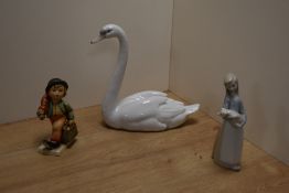 A Lladro porcelain study of a swan, 21.5cm with printed and impressed marks to base, together with a