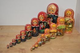 A large Russian hand-decorated Matryoshka doll, ten graduating dolls in total, most likely birchwood