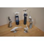 A group of six Lladro porcelain figurines and bird studies, comprising two nun figurines 5550 &